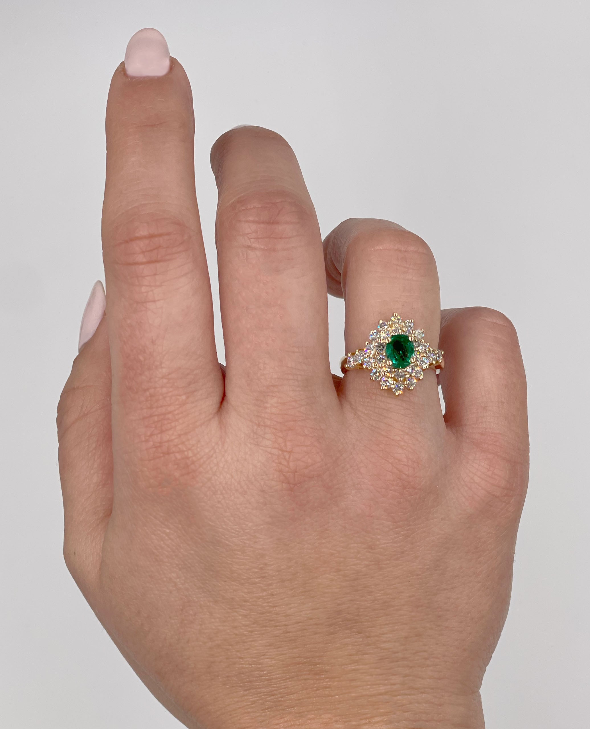14K Yellow Gold Oval Emerald 0.70 Carats and 28 Round Diamonds 1.00 Carats Ring