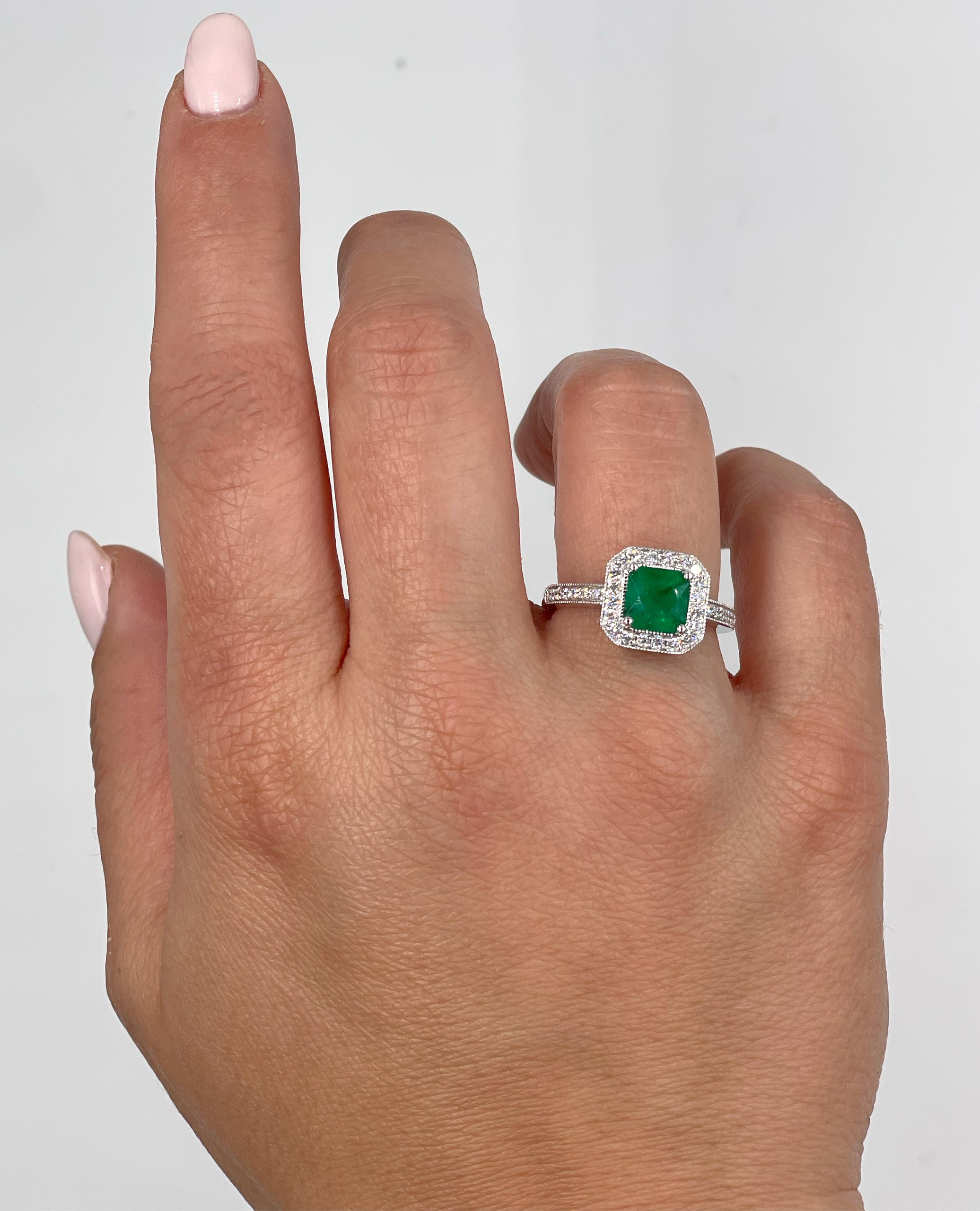 Halo Ring Set in 14K White Gold with 1.19 Carat Emerald and Round Diamonds