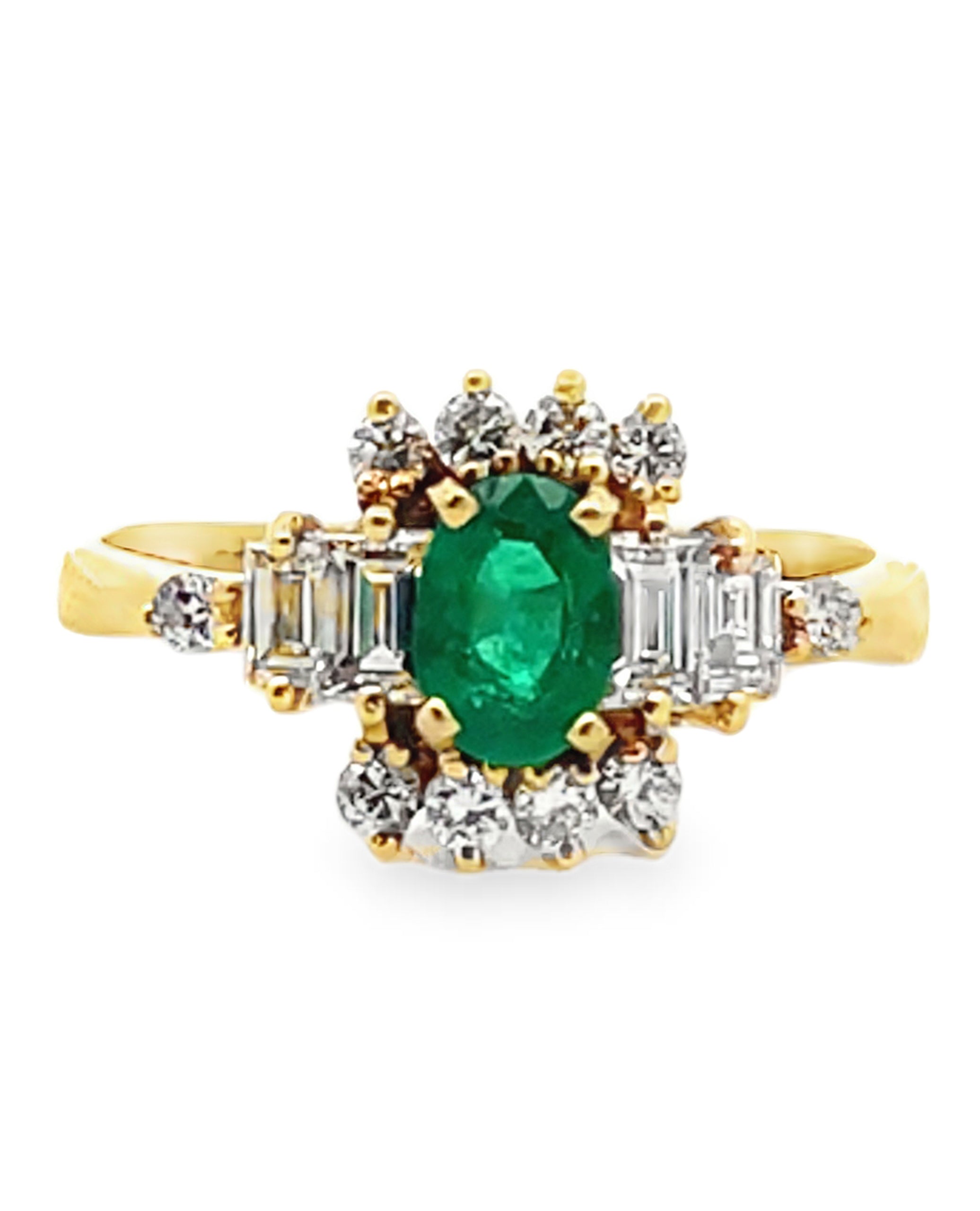 Vintage Oval Emerald Ring with Round and Baguette Diamonds Set in 18K Yellow Gold
