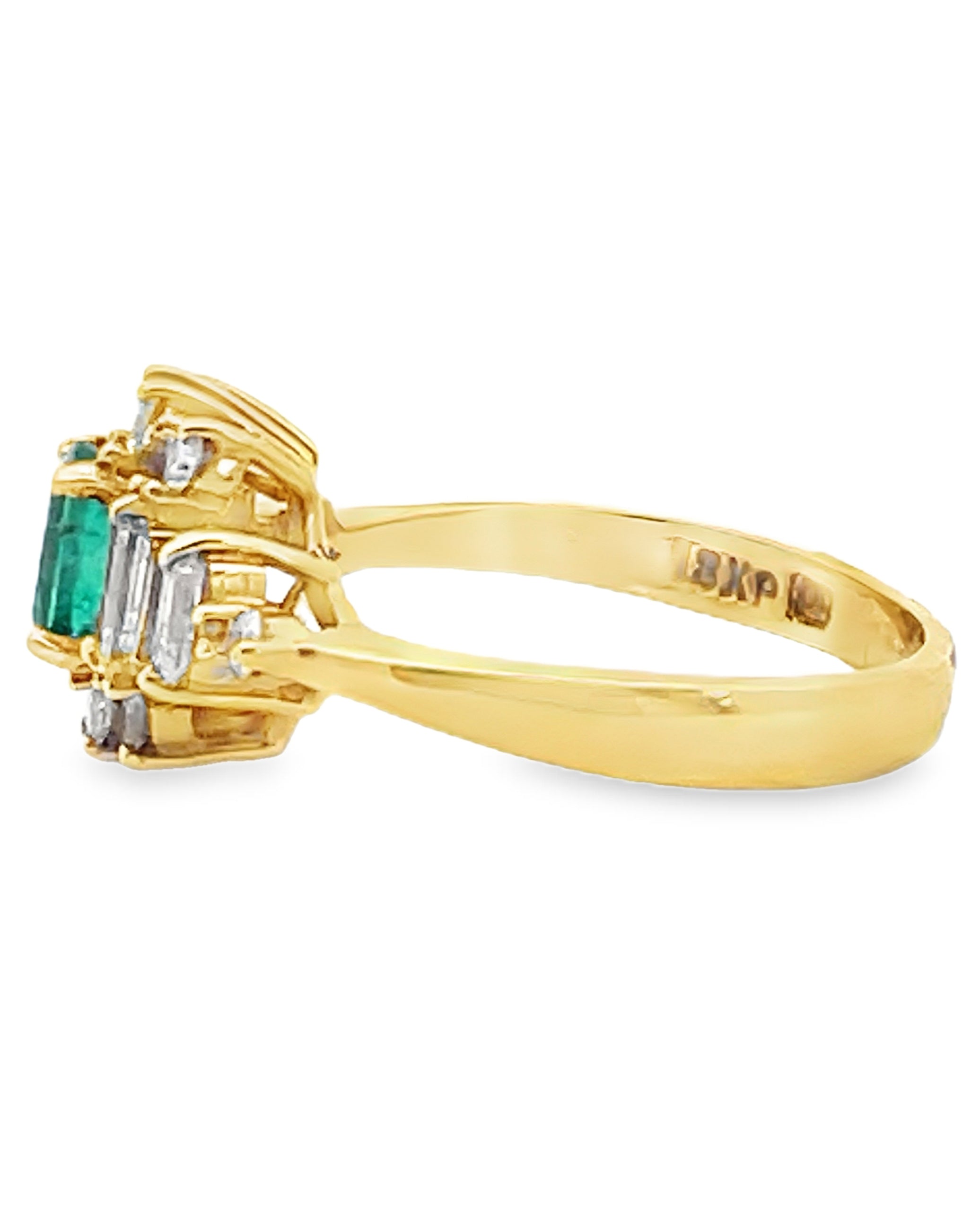 Vintage Oval Emerald Ring with Round and Baguette Diamonds Set in 18K Yellow Gold