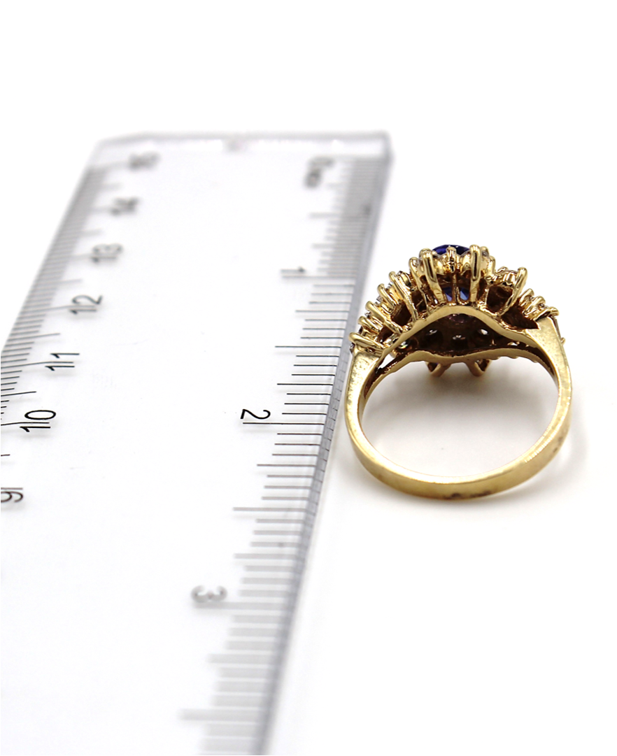 Vintage Oval Tanzanite Ring with Round and Baguette Diamonds Set in 14k Gold