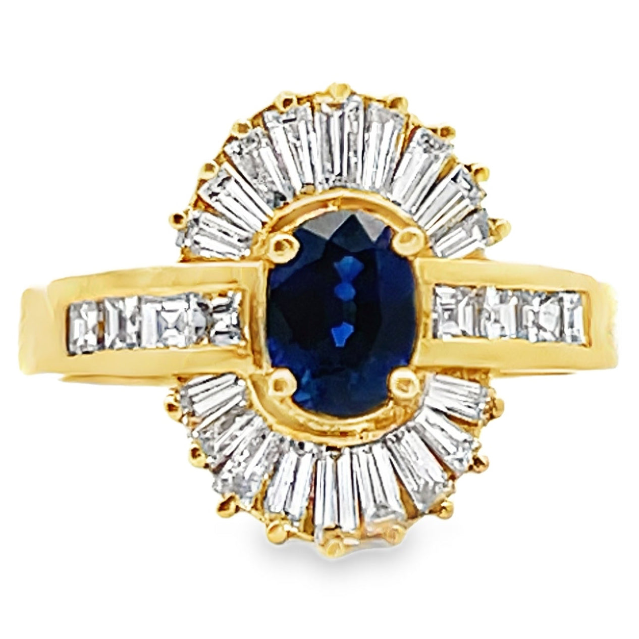 Vintage Oval 0.77 Carat Sapphire Ring with Baguette and Princess Cut Diamonds Set in 18K Gold