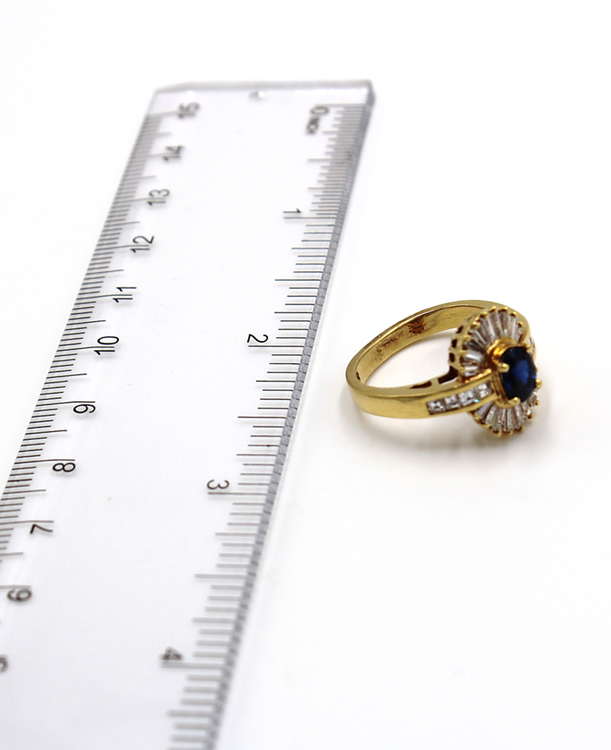 Vintage Oval Sapphire Ring with Baguette and Princess Cut Diamonds Set in 18K Gold