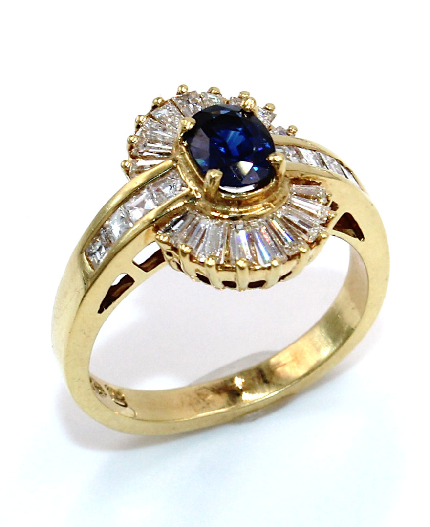Vintage Oval Sapphire Ring with Baguette and Princess Cut Diamonds Set in 18K Gold