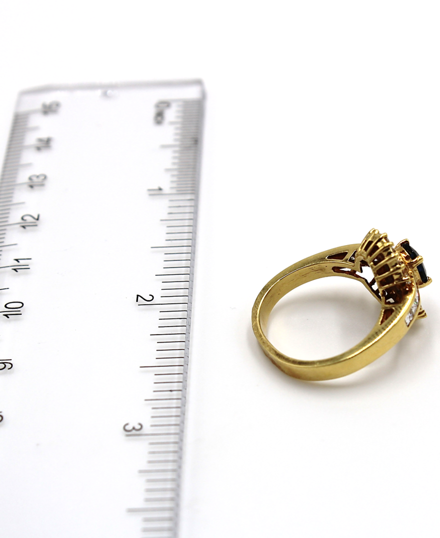 Vintage Oval Sapphire Ring with Baguette and Princess Cut Diamonds Set in 18K Gold