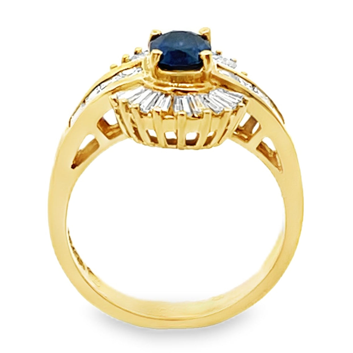 Vintage Oval 0.77 Carat Sapphire Ring with Baguette and Princess Cut Diamonds Set in 18K Gold