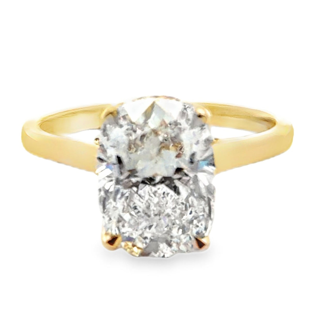 Custom made 14K yellow engagement ring setting with natural diamonds on the bridge and hidden halo totaling 0.10 carat. One center oval lab grown diamond 3.23 carat (E color, VVS2 clarity, IGI report number 762541955)