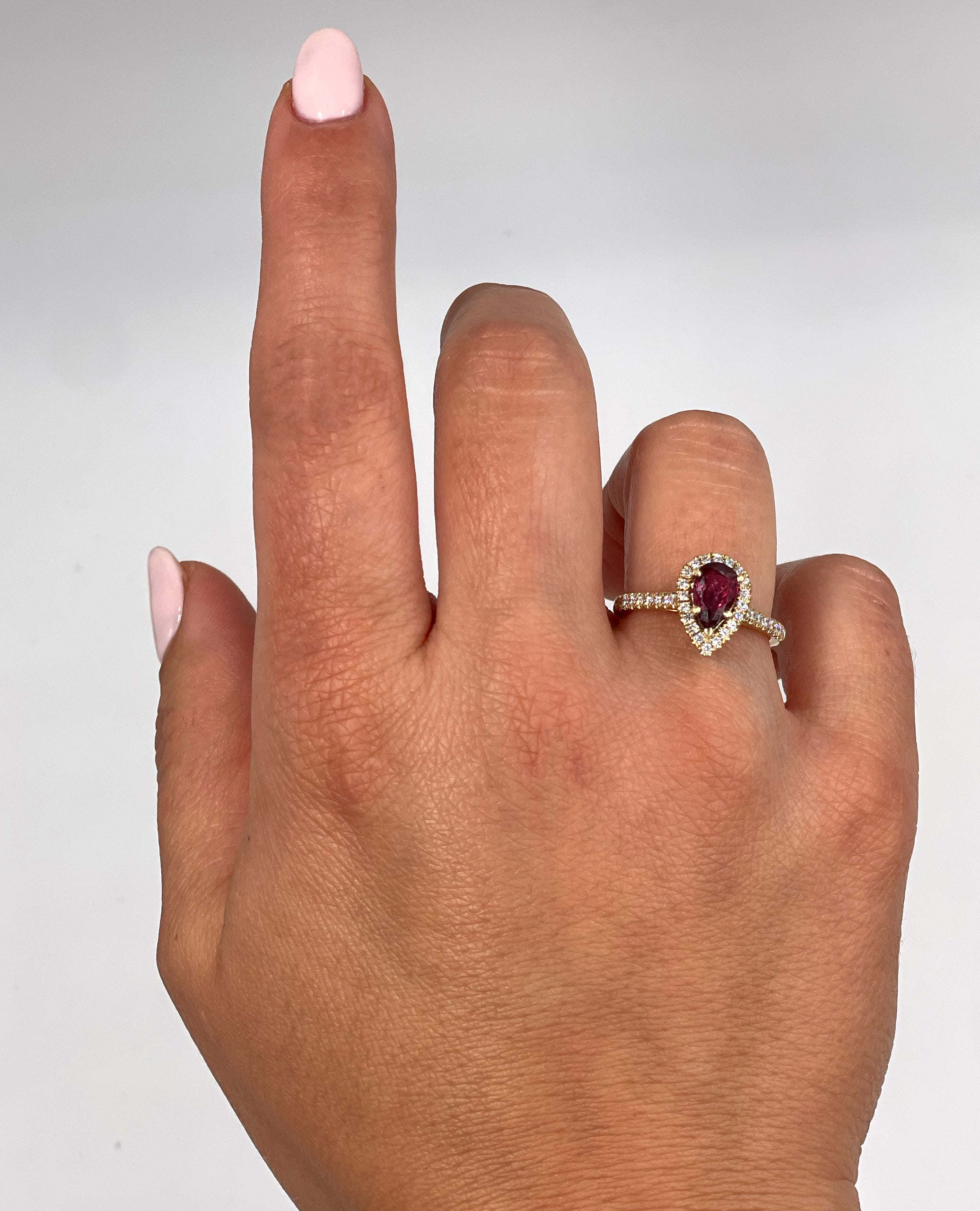 Pear Shaped Ruby Ring with Halo Diamonds Set in 14K Yellow Gold