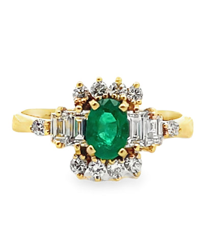 Vintage Oval Emerald Ring with Round and Baguette Diamonds Set in 18K Yellow Gold