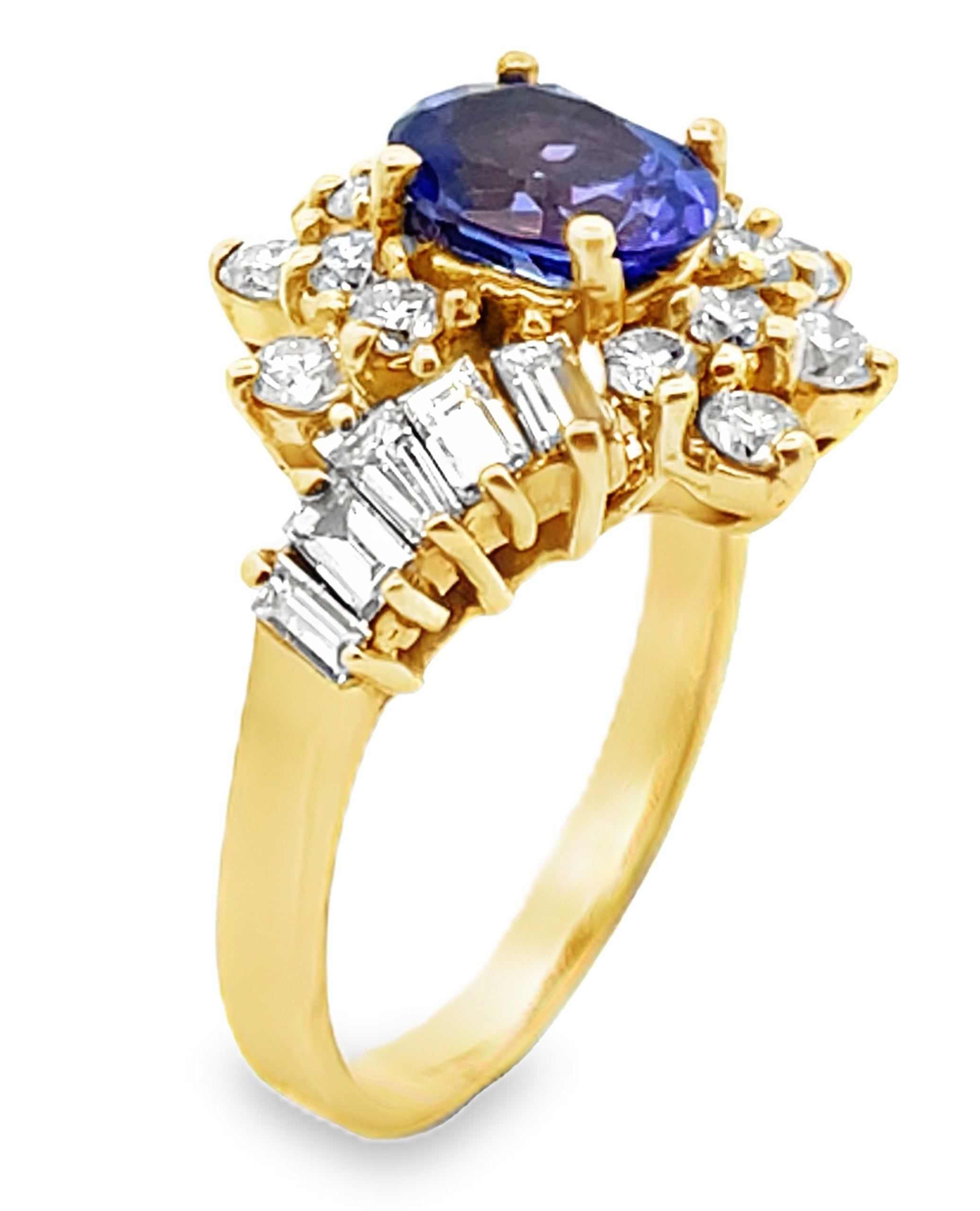 Vintage Oval Tanzanite Ring with Round and Baguette Diamonds Set in 14k Gold