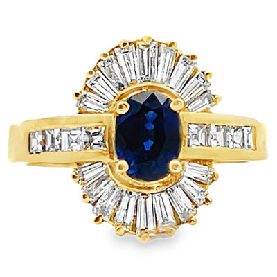 Vintage Oval 0.77 Carat Sapphire Ring with Baguette and Princess Cut Diamonds Set in 18K Gold