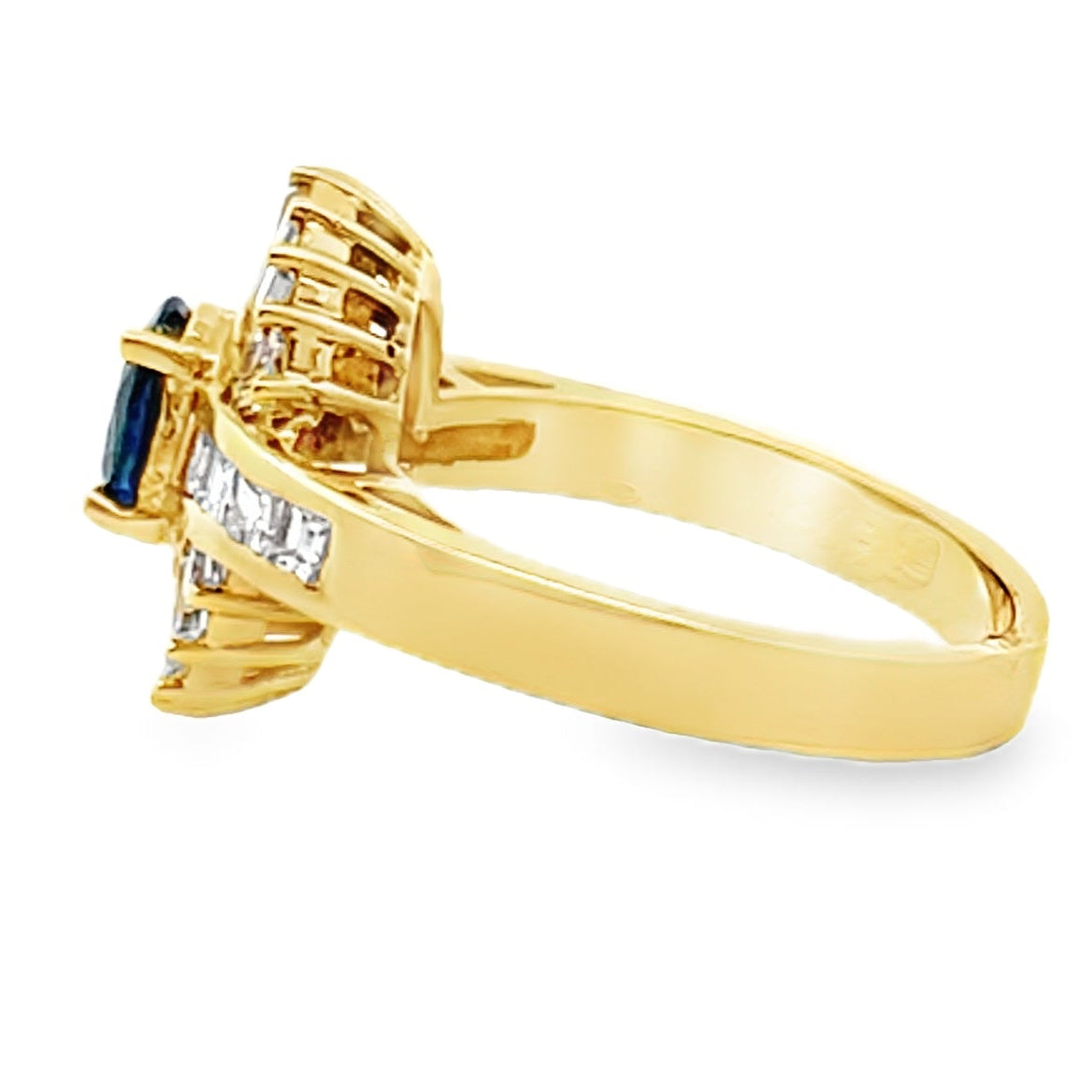 Vintage Oval 0.77 Carat Sapphire Ring with Baguette and Princess Cut Diamonds Set in 18K Gold