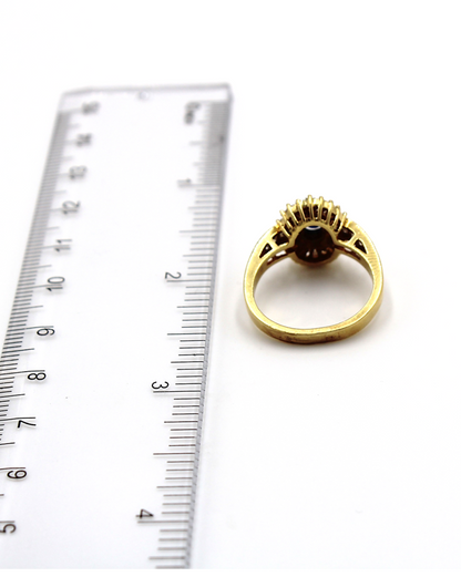 Vintage Oval Sapphire Ring with Baguette and Princess Cut Diamonds Set in 18K Gold