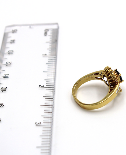 Vintage Oval Sapphire Ring with Baguette and Princess Cut Diamonds Set in 18K Gold