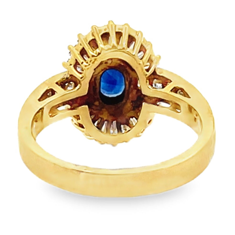 Vintage Oval 0.77 Carat Sapphire Ring with Baguette and Princess Cut Diamonds Set in 18K Gold