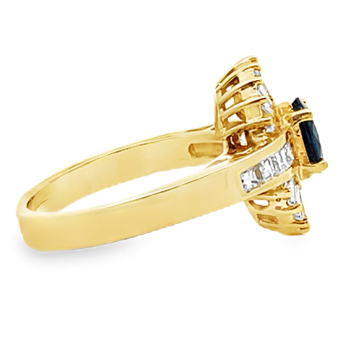 Vintage Oval 0.77 Carat Sapphire Ring with Baguette and Princess Cut Diamonds Set in 18K Gold