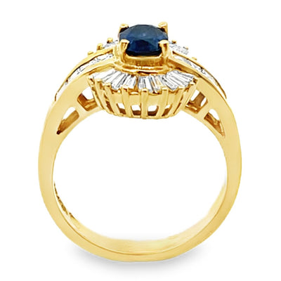 Vintage Oval 0.77 Carat Sapphire Ring with Baguette and Princess Cut Diamonds Set in 18K Gold