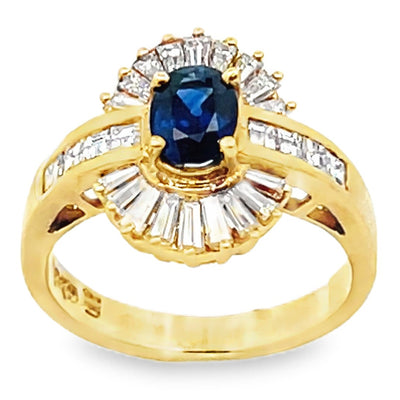 Vintage Oval 0.77 Carat Sapphire Ring with Baguette and Princess Cut Diamonds Set in 18K Gold