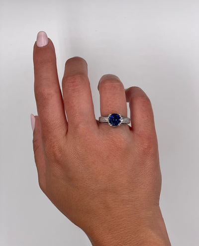Round Sapphire in Platinum Ring with Diamonds and Hand Engraving