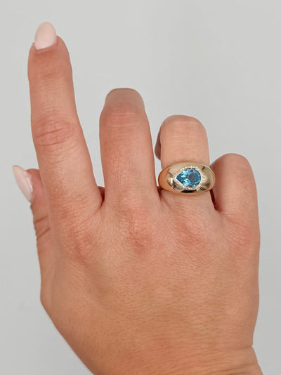 14K Yellow Gold Domed Ring With Diamonds Totaling 0.08 Carat, One Pear Shaped Blue Topaz 1.72 Carats