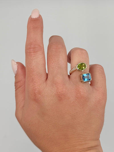 14K Yellow Gold Bypass Ring With Diamonds Totaling 0.23 Carats, One Blue Topaz 2.64 Carats, One Oval Peridot 1.73 Carats