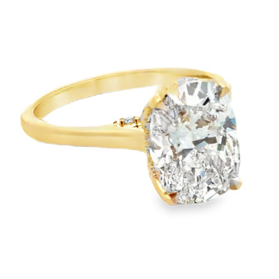 Custom made 14K yellow engagement ring setting with natural diamonds on the bridge and hidden halo totaling 0.10 carat. One center oval lab grown diamond 3.23 carat (E color, VVS2 clarity, IGI report number 762541955)