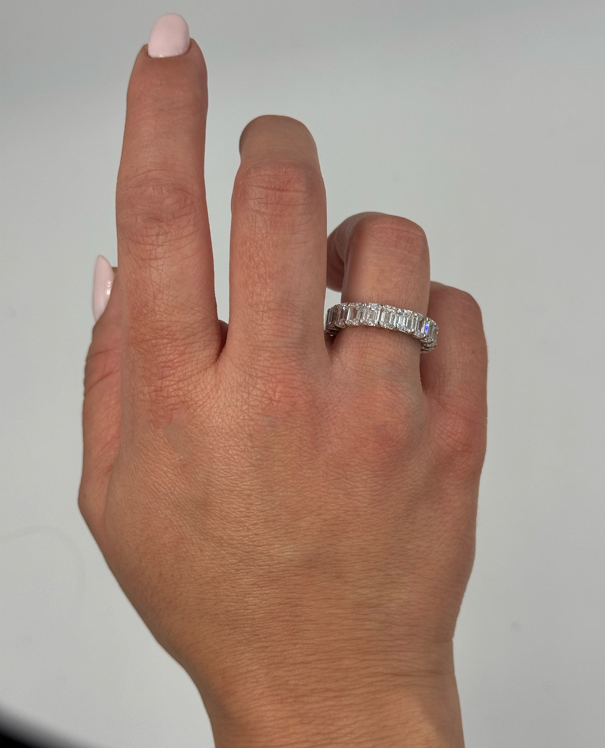 14K White Gold Eternity Band with Lab Grown 6.91 Carat Emerald Cut Diamonds