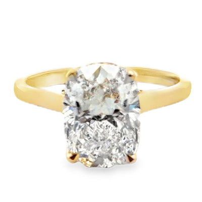 Custom made 14K yellow engagement ring setting with natural diamonds on the bridge and hidden halo totaling 0.10 carat. One center oval lab grown diamond 3.23 carat (E color, VVS2 clarity, IGI report number 762541955)