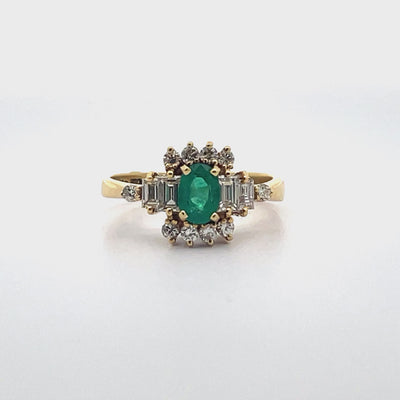 Vintage Oval Emerald Ring with Round and Baguette Diamonds Set in 18K Yellow Gold