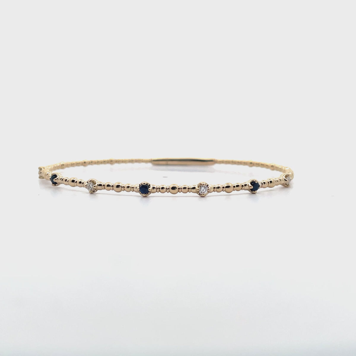 14K Yellow Gold Seven Station 0.13 Carat Sapphire, 0.12 Carat Diamond Flexible Bangle Bracelet