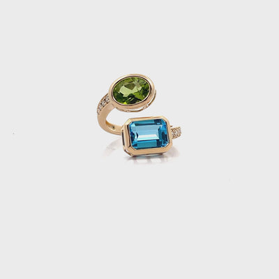 14K Yellow Gold Bypass Ring With Diamonds Totaling 0.23 Carats, One Blue Topaz 2.64 Carats, One Oval Peridot 1.73 Carats