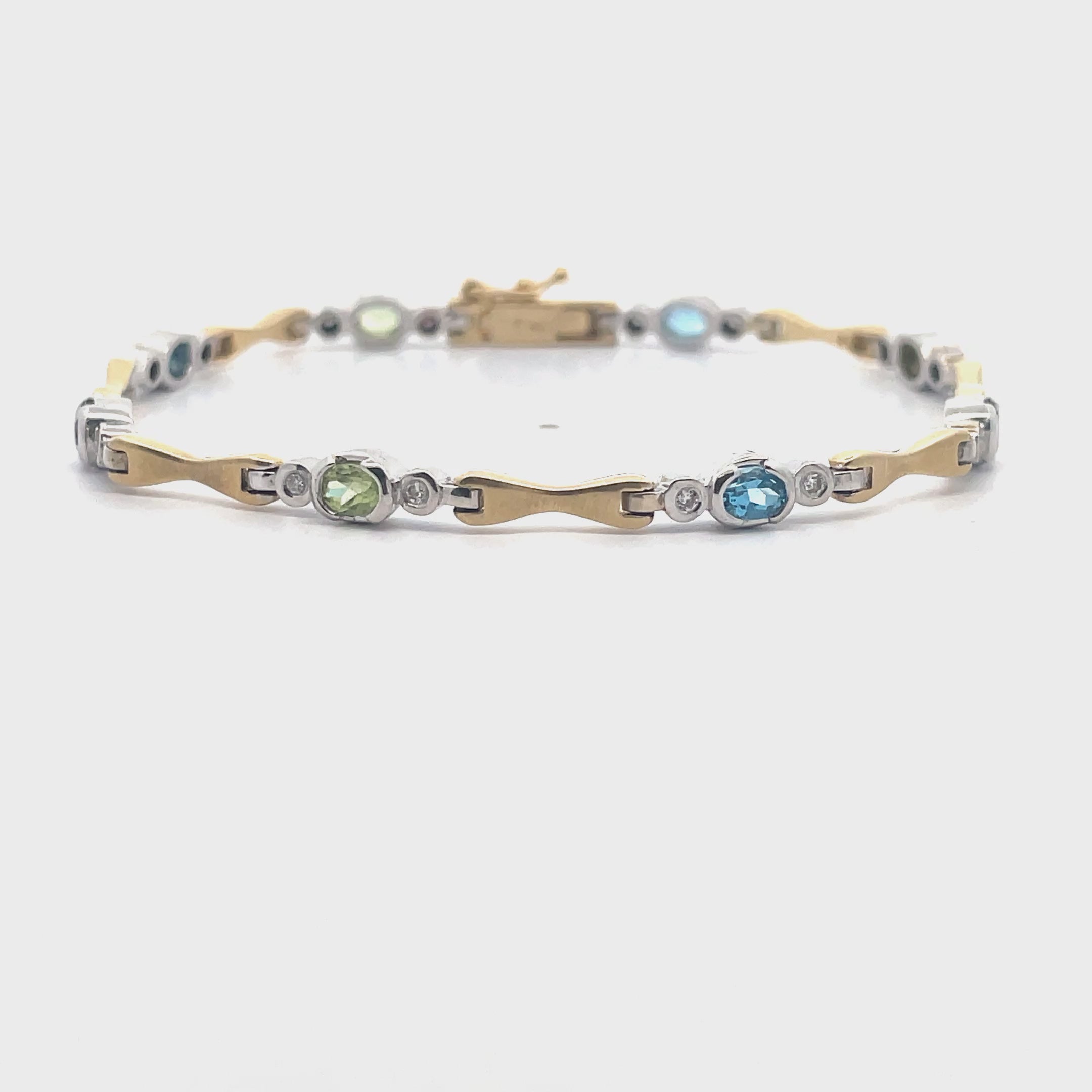 Φόρτωση βίντεο: 14K Two Tone Gold bracelet with 16 Round Diamonds Weighing 0.18 Carat and 8 Oval Multicolor Semiprecious Stones