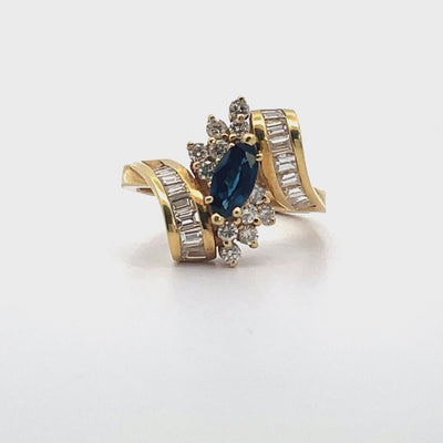 Vintage 0.80 Carat Marquise Sapphire Ring with Bageutte and Round Diamonds 1.10 Carats in 18K Yellow Gold