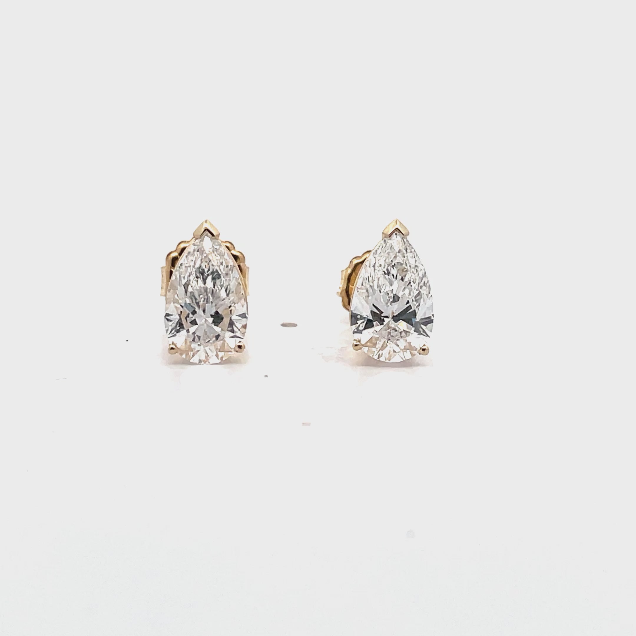 Load video: 14K Yellow Gold Pear Shaped Lab Grown Diamond Post Earrings with Pushback Closures - 2.87 carats