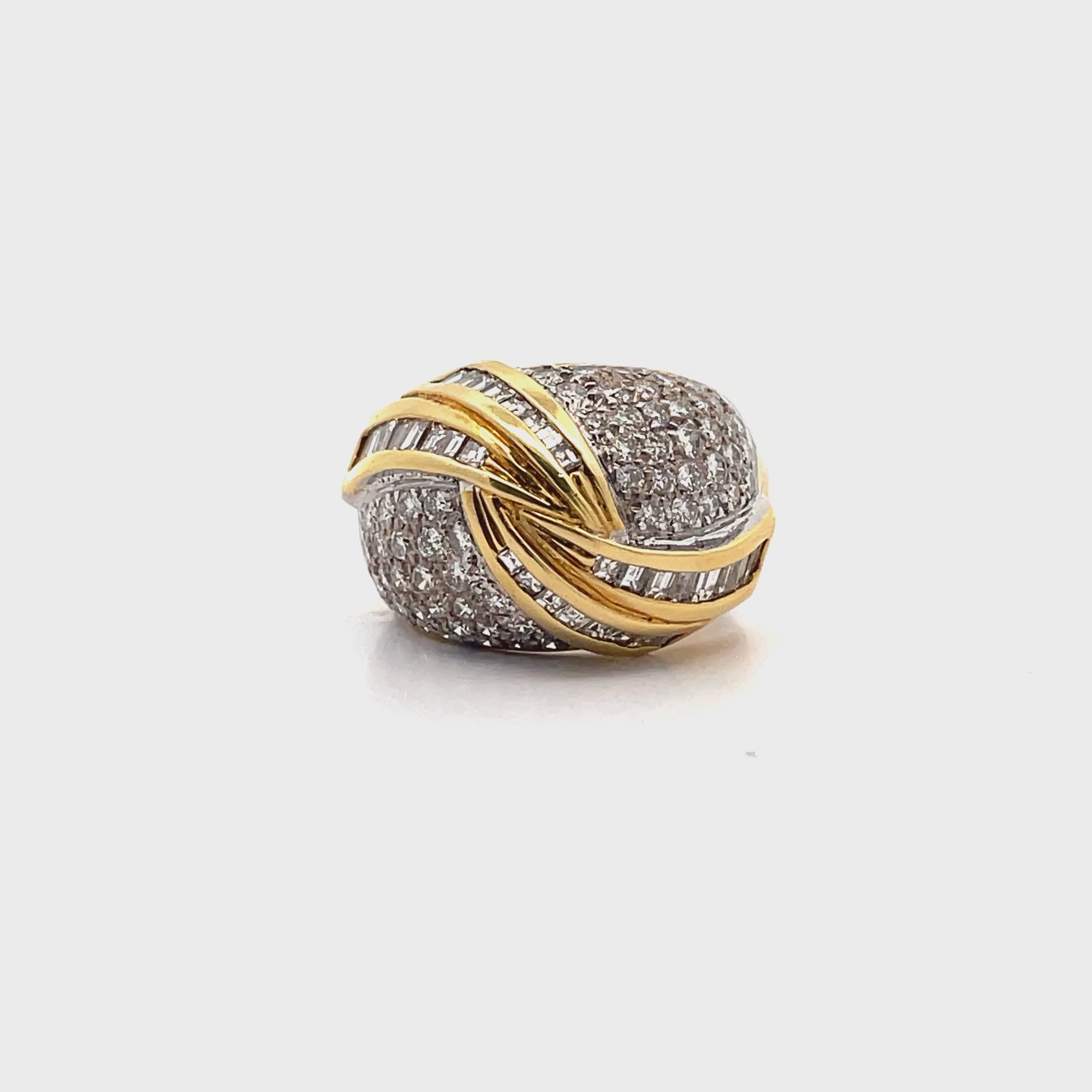 Load video: Vintage 2.15 Carat Round and Baguette Diamond Swirl Dome Ring in 18K Gold