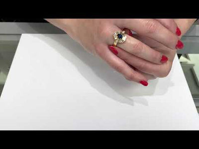 Vintage Oval Sapphire Ring with Baguette and Princess Cut Diamonds Set in 18K Gold